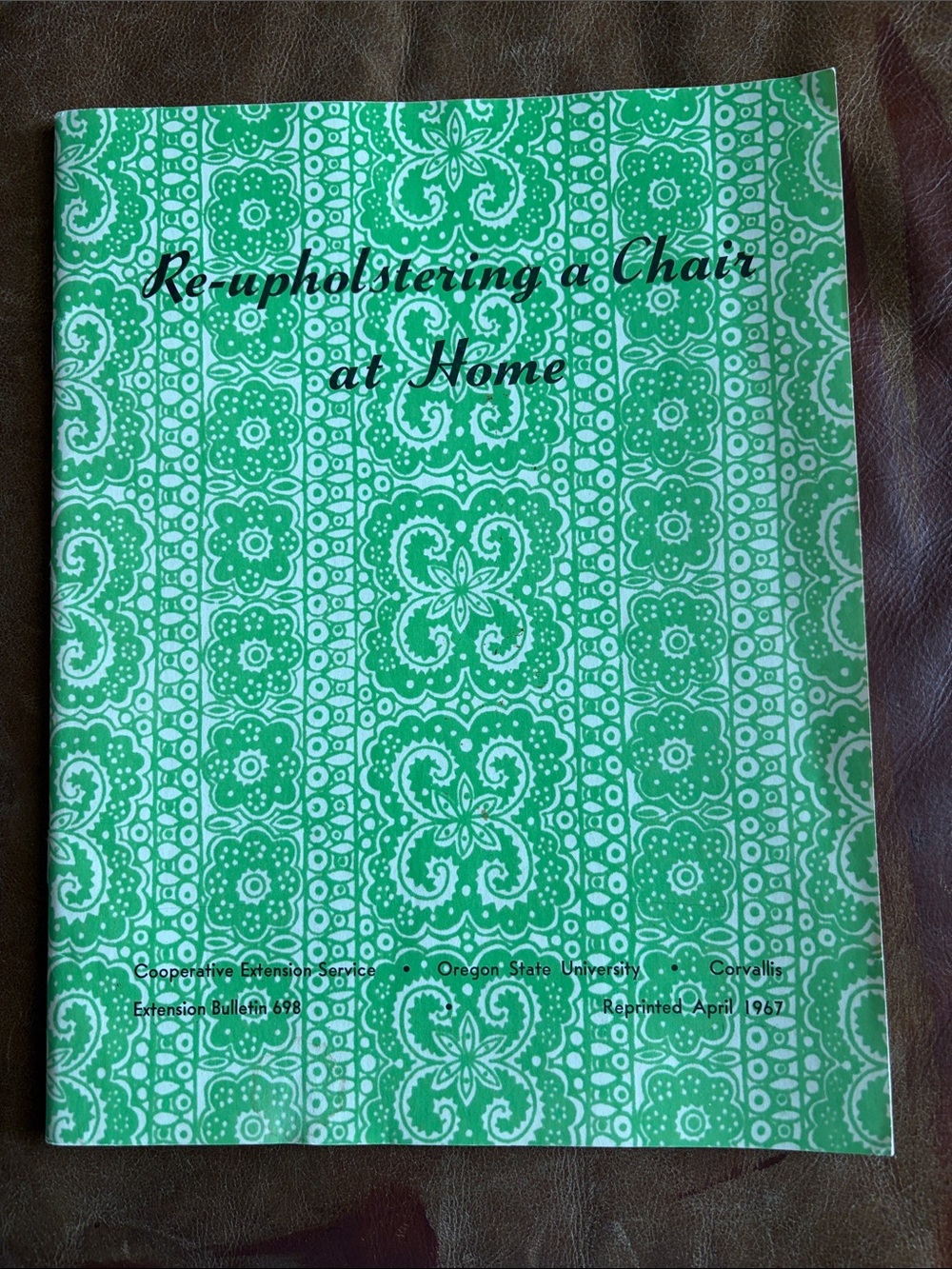 Green Patterned Booklet "Re-upholstering a Chair at Home"